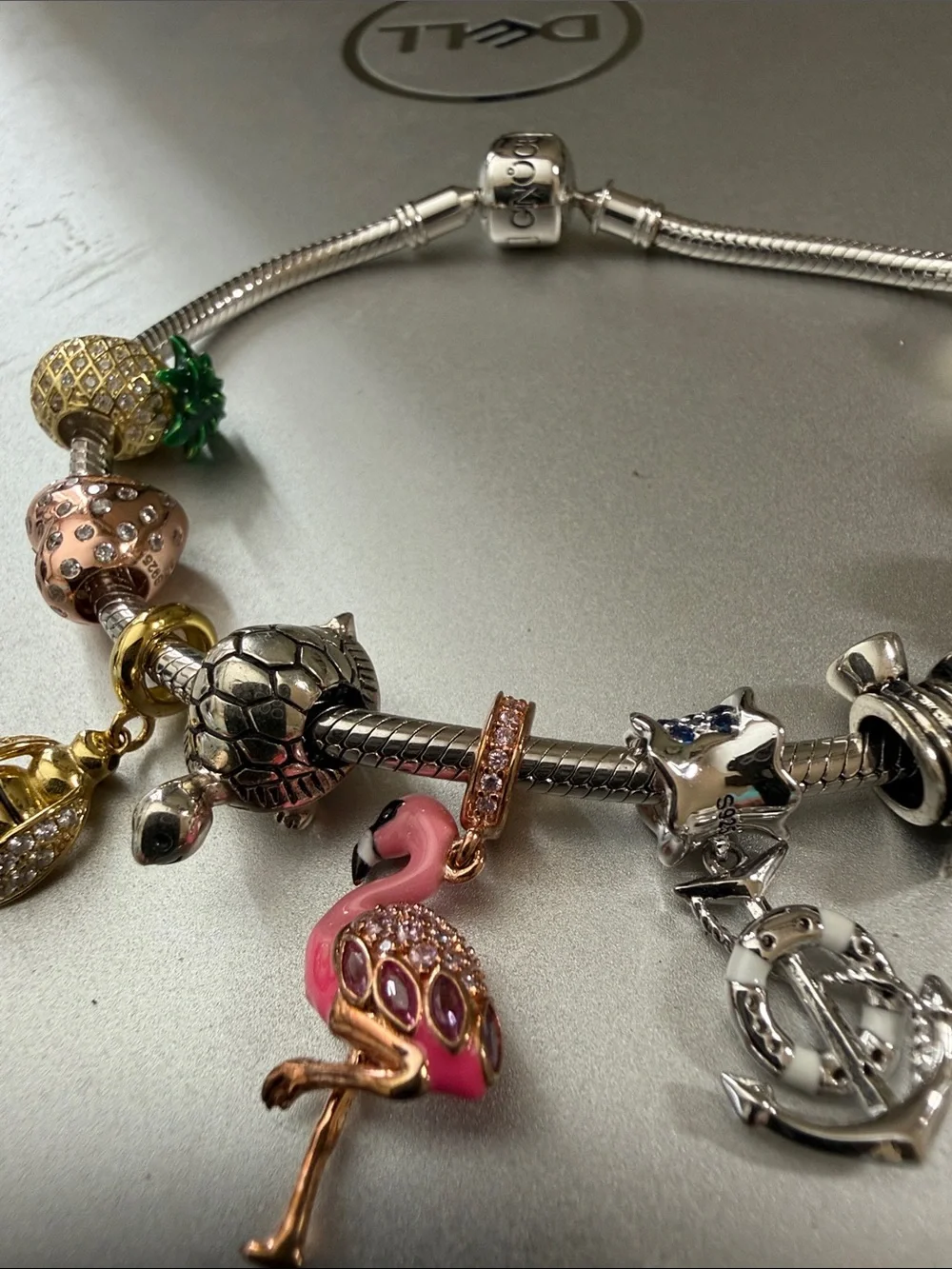 Stunning silver Pandora type 8” charm bracelet with 10 removable charms.